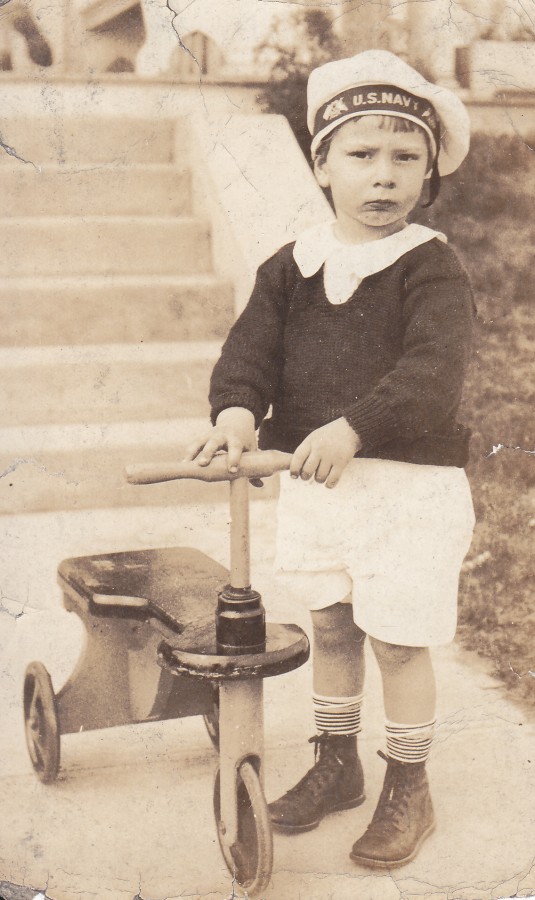 Norm Jr young with tricycle